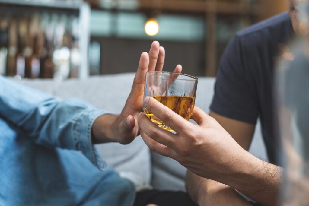 a person works to prevent alcohol misuse by refusing a drink