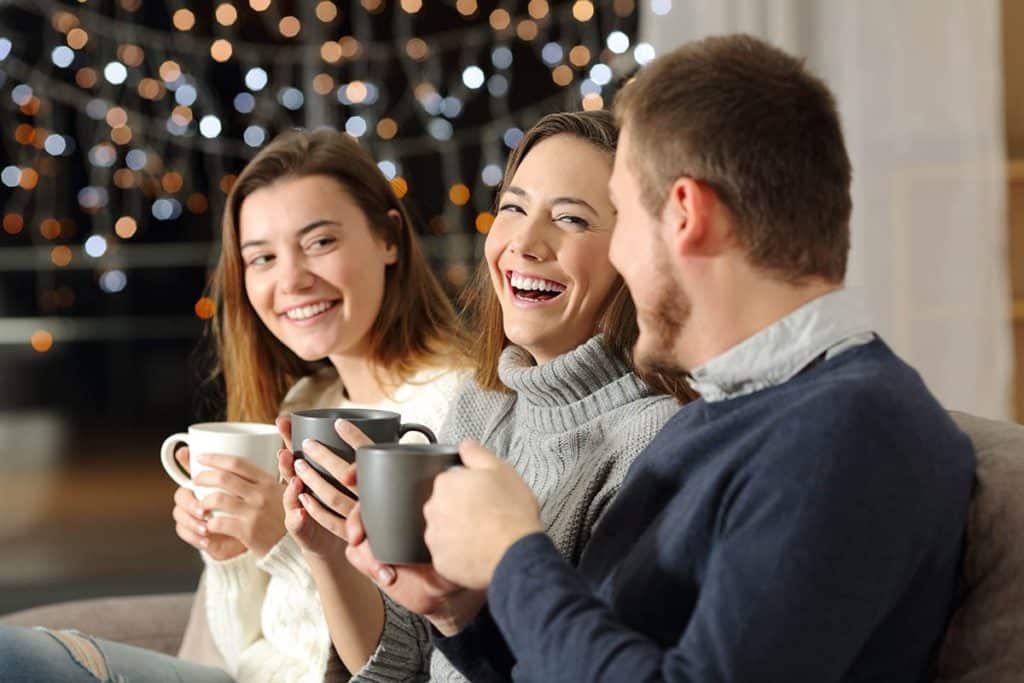 family laughing and enjoying a sober Christmas together