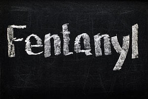 top view of black chalk board with lettering fentanyl