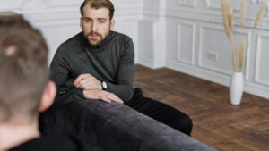 photo of a man in therapy, contact swift river for help getting DBT for addiction.