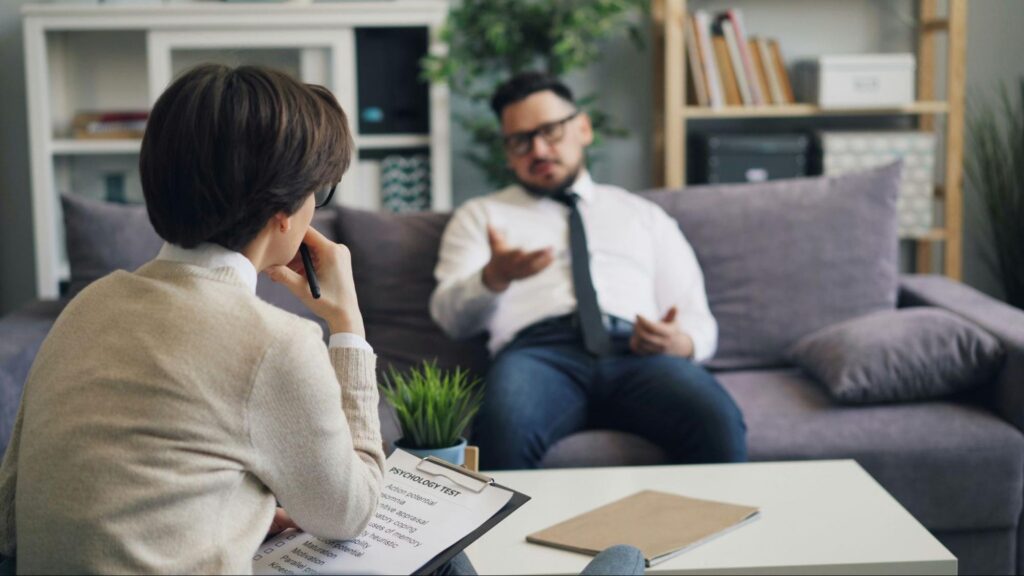 A man speaks with a therapist as part of his PTSD Treatment in Massachusetts